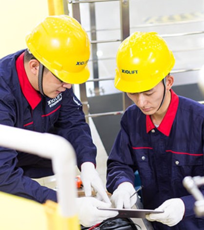 XIOLIFT technicians reviewing equipment on site
